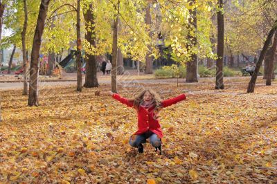 Young woman with autumn leaves