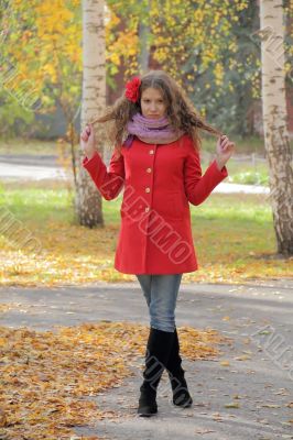 Beautiful young woman in red coat