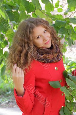 Beautiful young woman in red coat