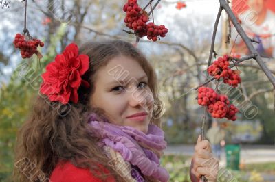 Young woman with autumn leaves