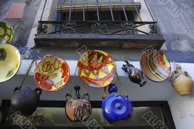 Many handcraft are exposed out of a shop in spain