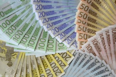 The back of euro notes form a pinwheel The back of euro notes form a pinwheel