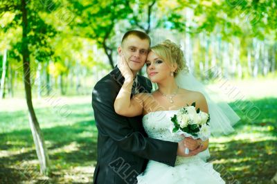 Bride and groom at the park