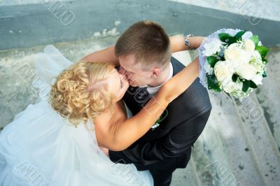 Bride and groom at the stairs