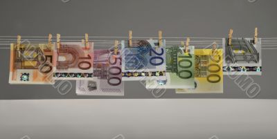 all kinds of Euro banknotes hanging on clotheshorse
