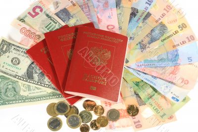 .Many banknotes of different countries and the passport for travel.