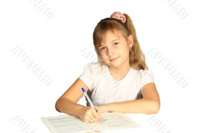 Beautiful little girl wrote in a notebook. Beautiful little girl wrote in a notebook.