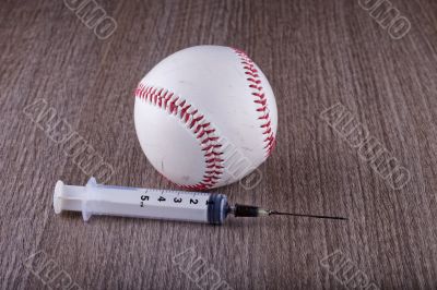 Baseball and syringe