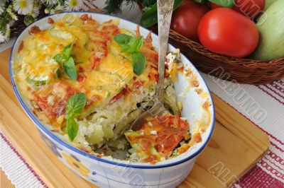 casserole of pasta with zucchini and tomato with cheese