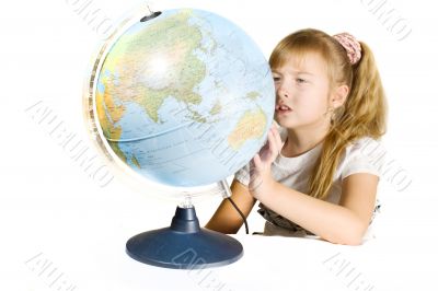 Beautiful little girl with a globe