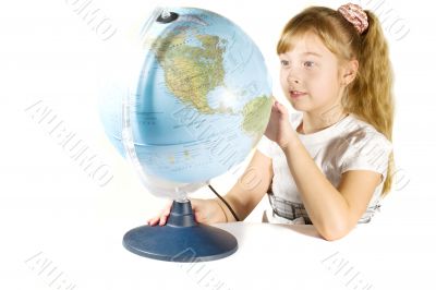Beautiful little girl with a globe