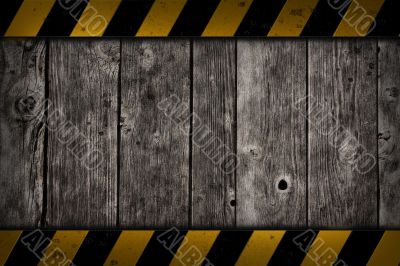 wooden background with warning bar
