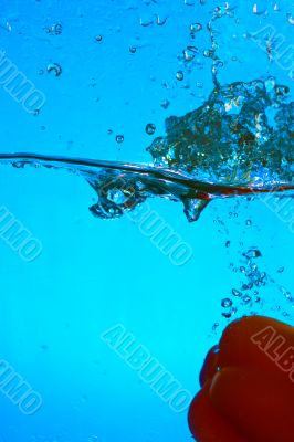 YELLOW PEPPER SPLASHING IN WATER 