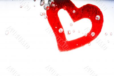 Valentine with red heart in water