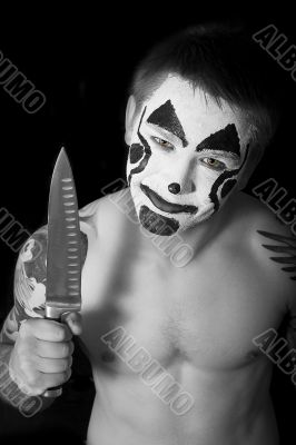 Evil clown with a knife