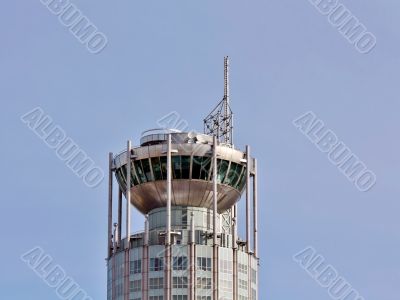 Tower at the top of modern building Tower at the top of modern building