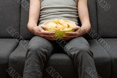 Man eating chips Man eating chips