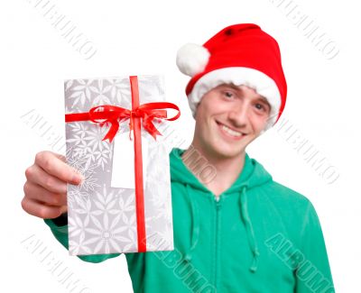 Man with santa hat holding christmas present