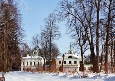 Old-time estate among leafless trees