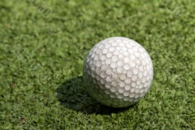 old scratched dirty golf ball