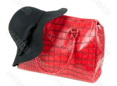 Red Fashion ladies handbag and a black felt hat