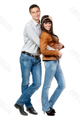Portrait of a beautiful young happy smiling couple - isolated