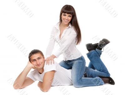 smiling couple in love lying on the floor
