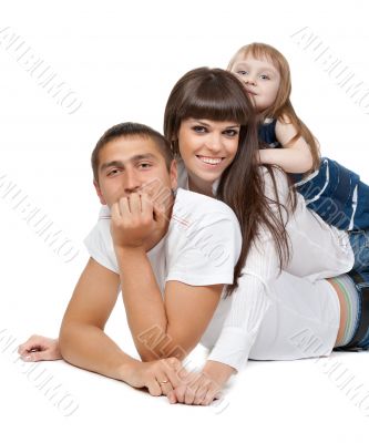 Happy family looking at the camera on their floor