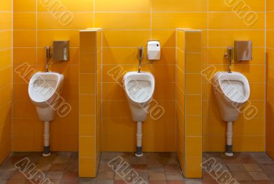 Three urinal in the bathroom