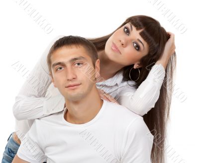 portrait of a beautiful young couple in the studio on a white ba