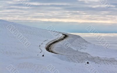 Dirt road in the snowy mountains