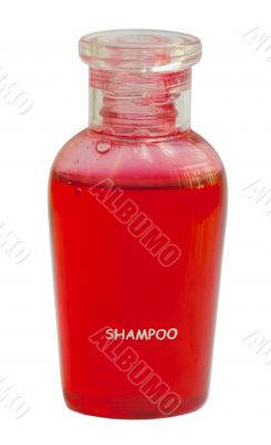Small red bottle of shampoo