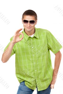 Casual portrait of a man in sunglasses and a green plaid shirt i