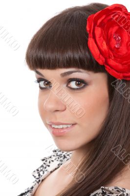 Beautiful woman with fabric rose flower in her hair