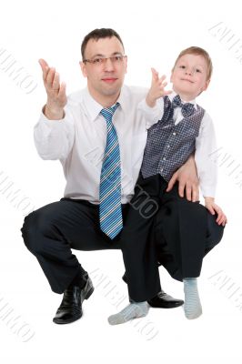 businessman and his son pulled his hands in the studio