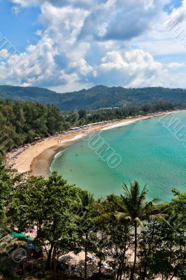 Tropical beach, in a cozy cove surrounded by hills