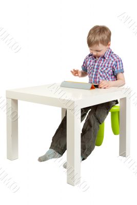 boy with a Tablet PC on the desk