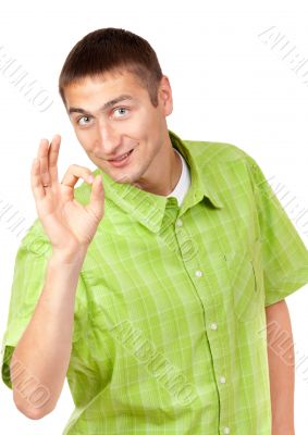 Portrait of a handsome young man showing a sign of Ok, a symbol.