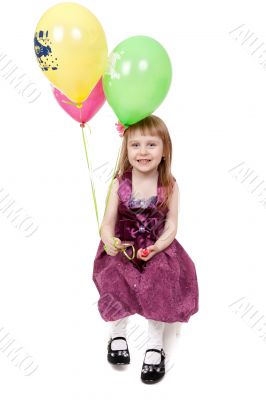 Full isolated studio picture from a little girl with balloons