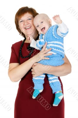 grandmother with her grandson in her arms in the studio
