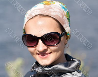 portrait of beautiful girl in the bandana and sunglasses