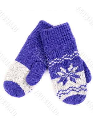 pair of knitted mittens with pattern snowflake