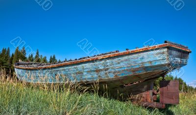 beached fishing trawler to give a well worn vintage look