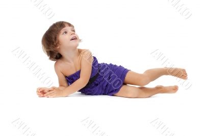 Happy girl lying on floor, isolated on white