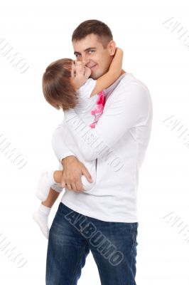 Studio portrait of loving young father hugging his child