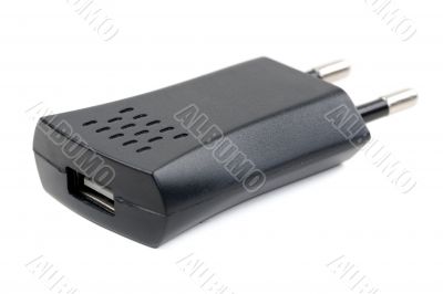 Black USB charger device isolated on white