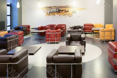 Interior of fashionable modern cafe with leather furniture