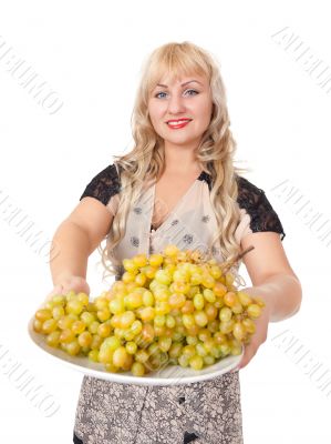 Portrait of attractive young woman holding bowl of grapes Portrait of attractive young woman holding bowl of grapes