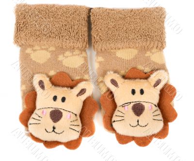 pair of children`s sneakers with a muzzle of a lion