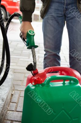 Man in jeans gas station in a plastic gasoline